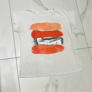 White T-shirt with Orange and Silver Accents
